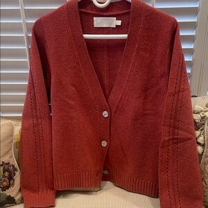 A cute cropped sweater, pretty color! Barely worn